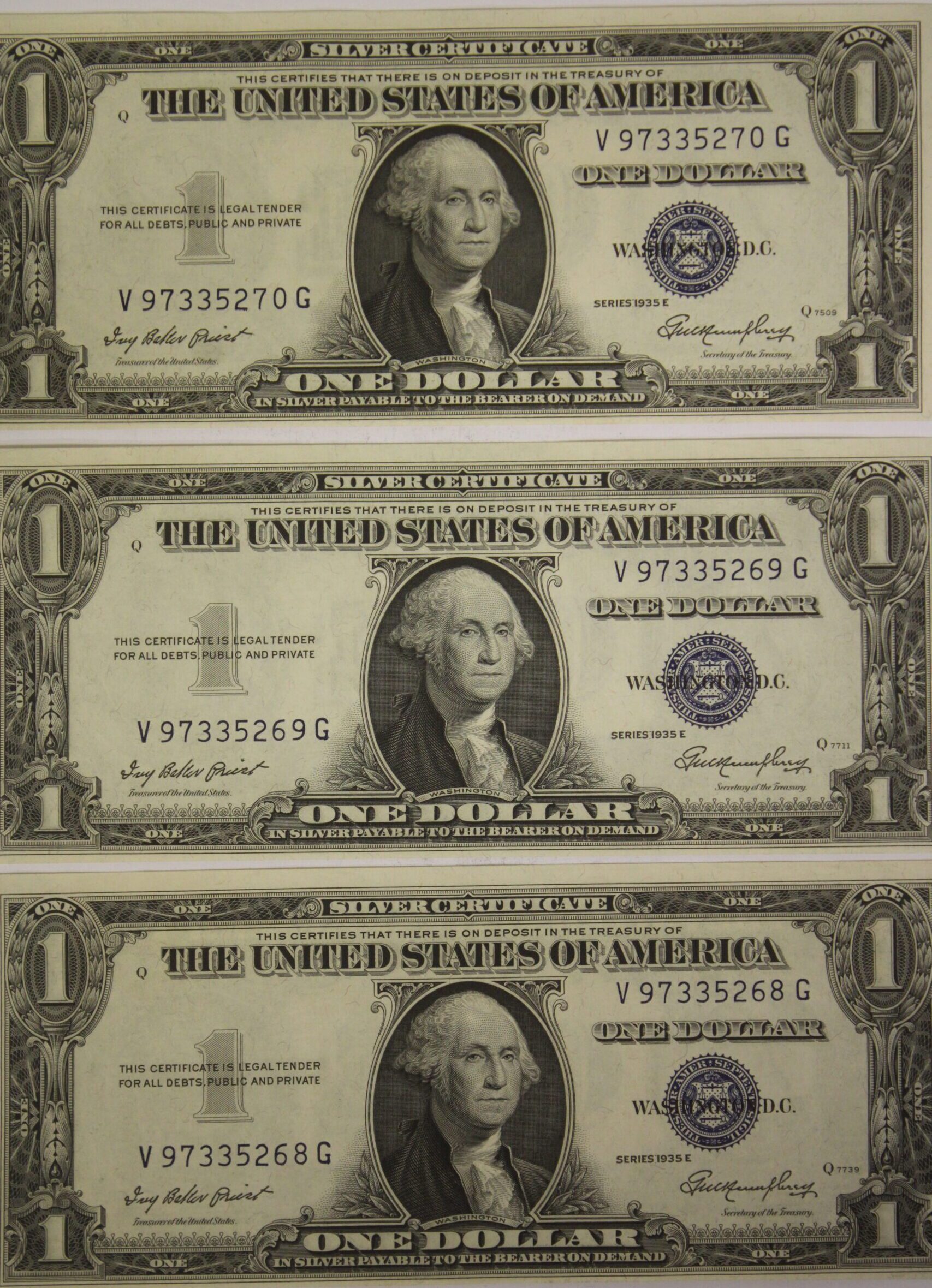 Three 1935-E One Dollar Silver Certificates Consecutive Serial Numbered Uncirculated