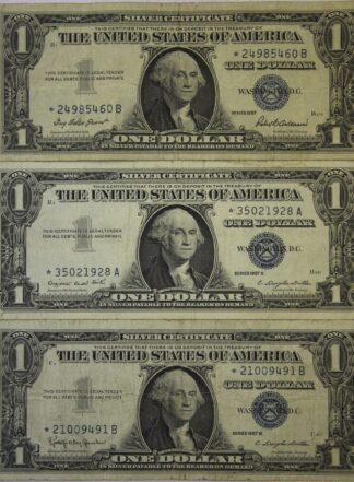 Our Choice 1 Random1957, 1957-A & 1957-B One Dollar Silver Certificate.   Well circulated.  Star Note