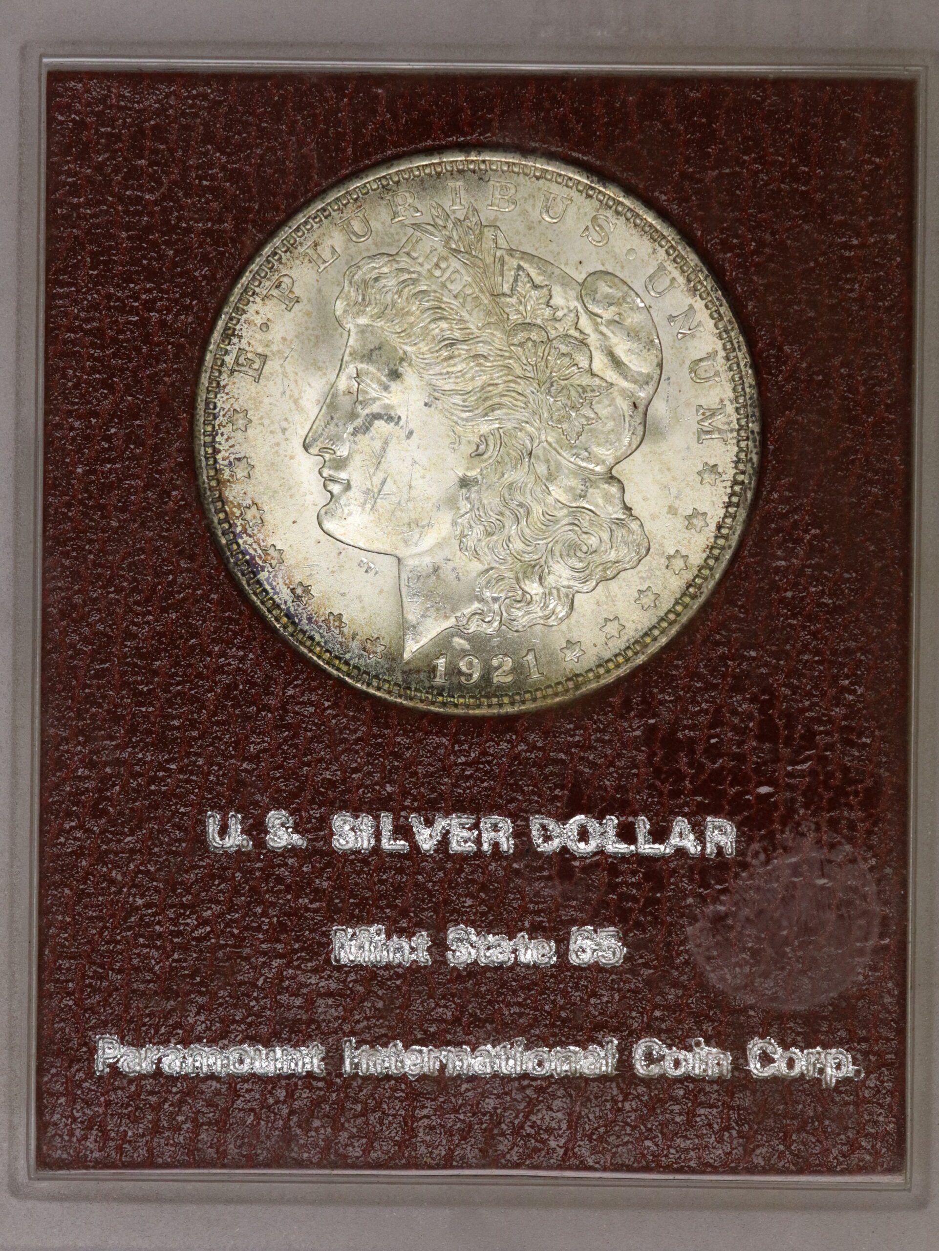 Auction-1921 Morgan Dollar "Mint State 65 Paramount International" Cracked Case on Reverse