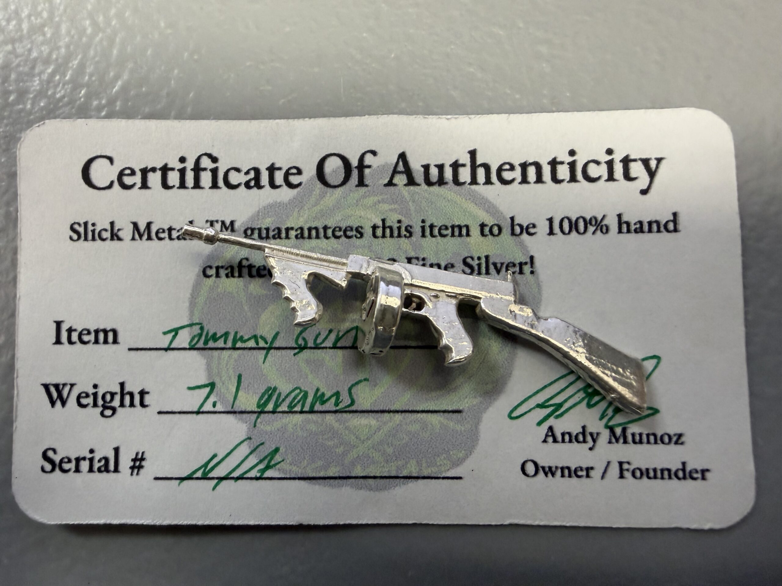 Auction-12.1 Grams .999 Silver including Tommy Gun and Five 1 Gram Rounds