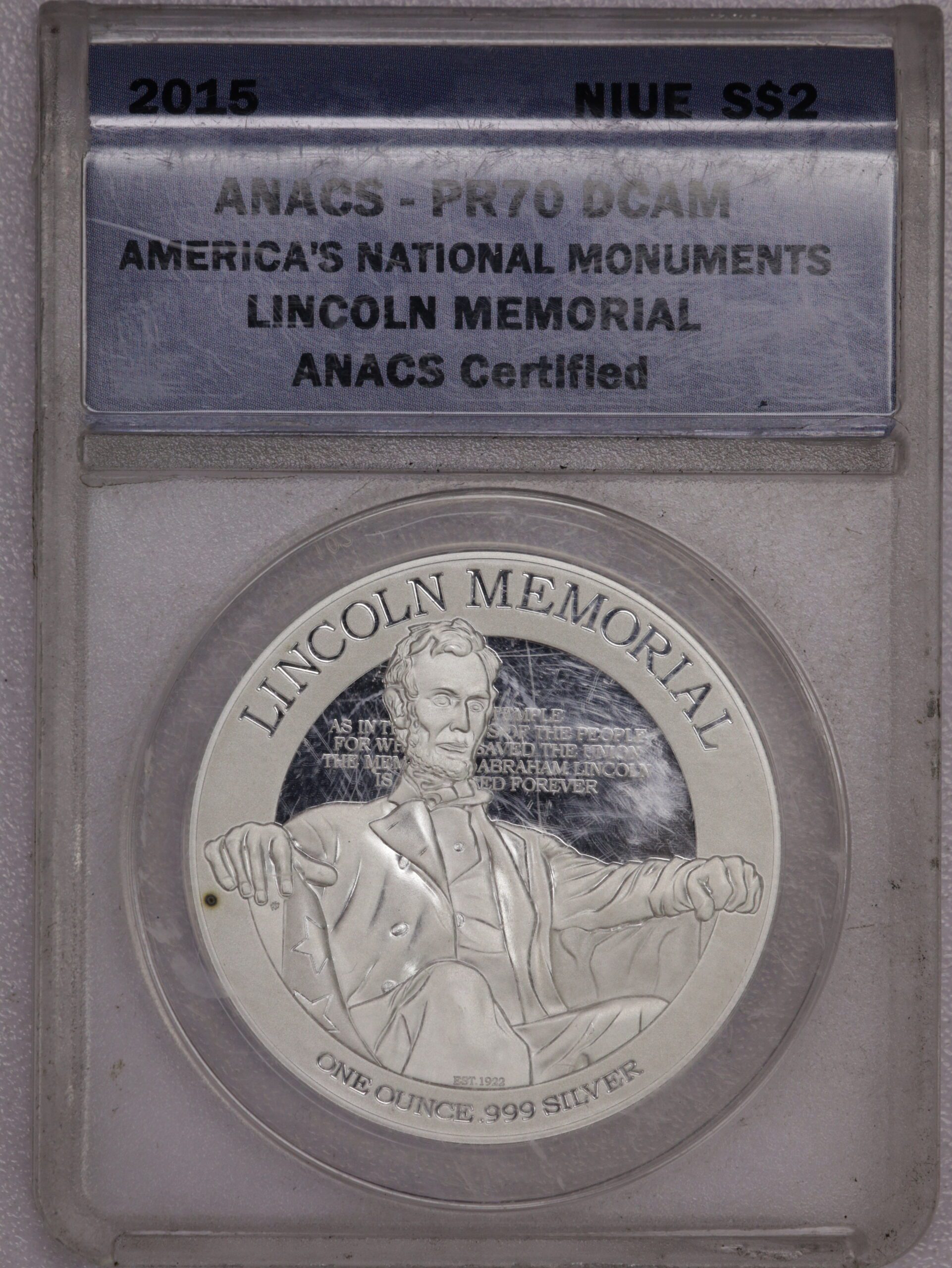 Auction-2015 Lincoln Memorial 1 Oz Silver ANACS Spot on Obverse, Milky, Scratched Holder