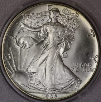 AUCTION-   1986 American Silver Eagle in Plastic Snap Tite Holder