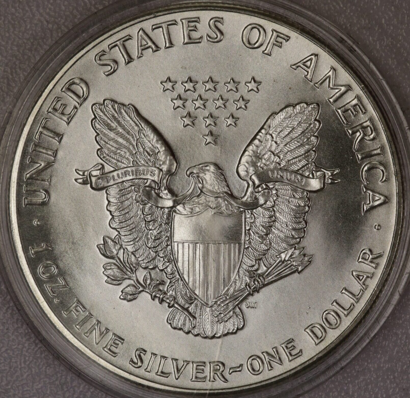 AUCTION- 1986 American Silver Eagle in Plastic Snap Tite Holder - Image 2