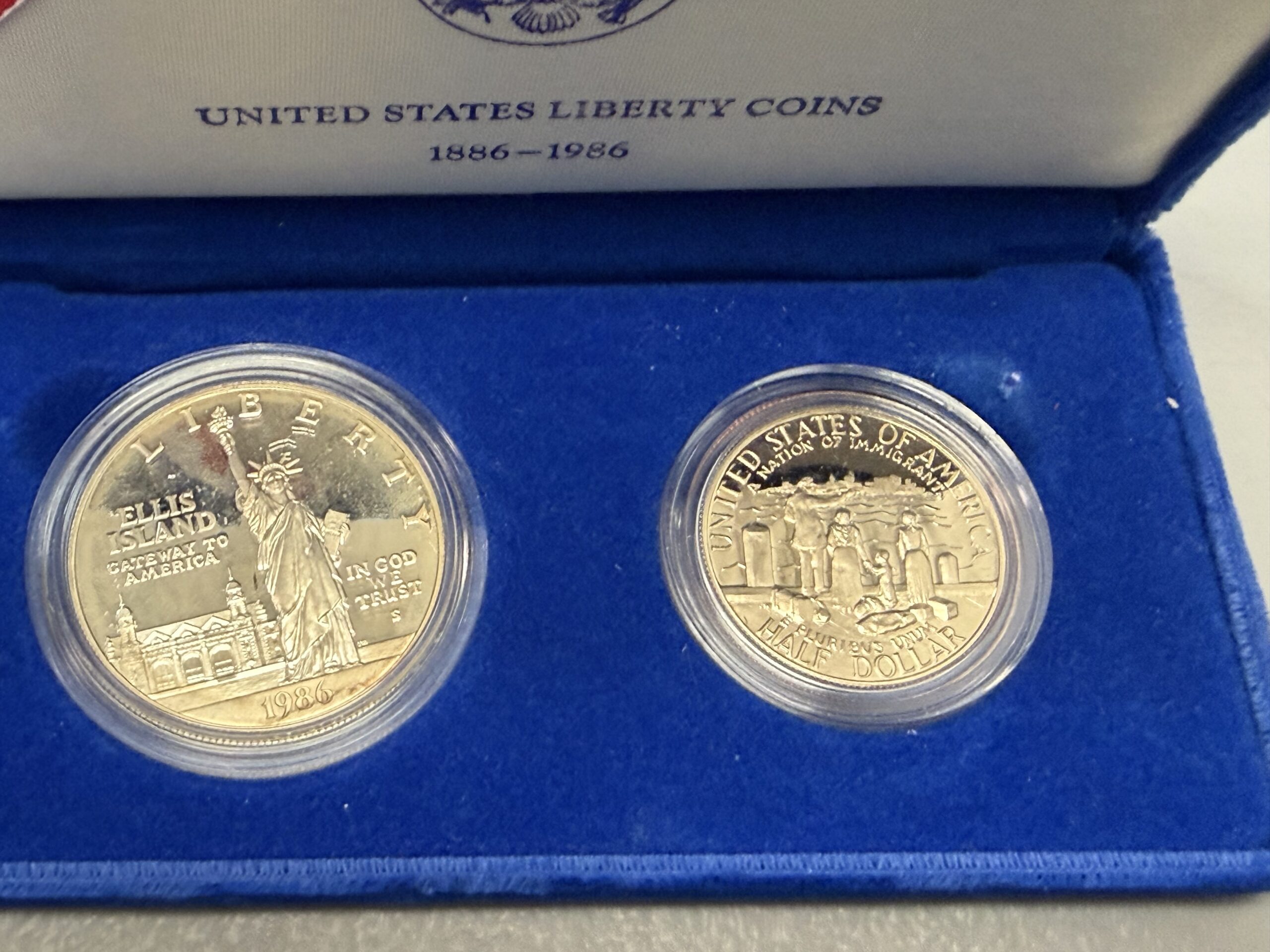 Auction-1986 Proof Liberty Silver Dollar and Proof Clad Half Dollar. Dollar Milky. OGP/COA